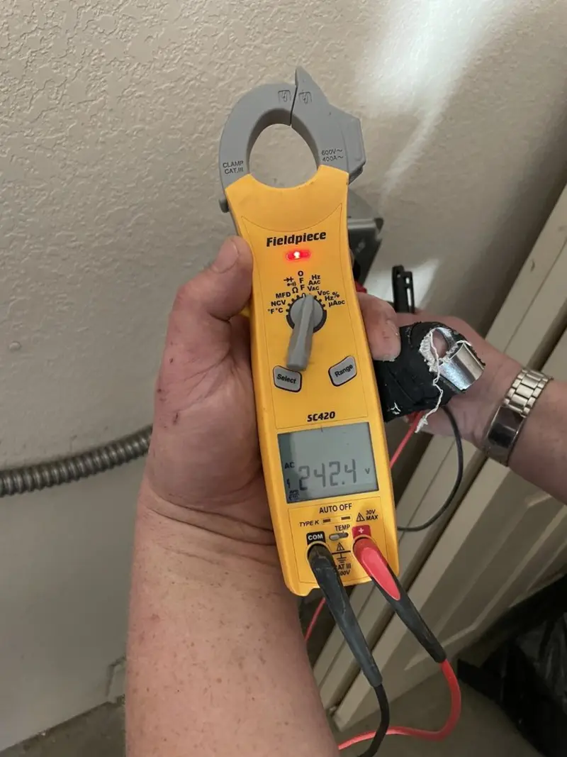 Voltage testing with clamp meter during Electrical Installation Services in Tewksbury